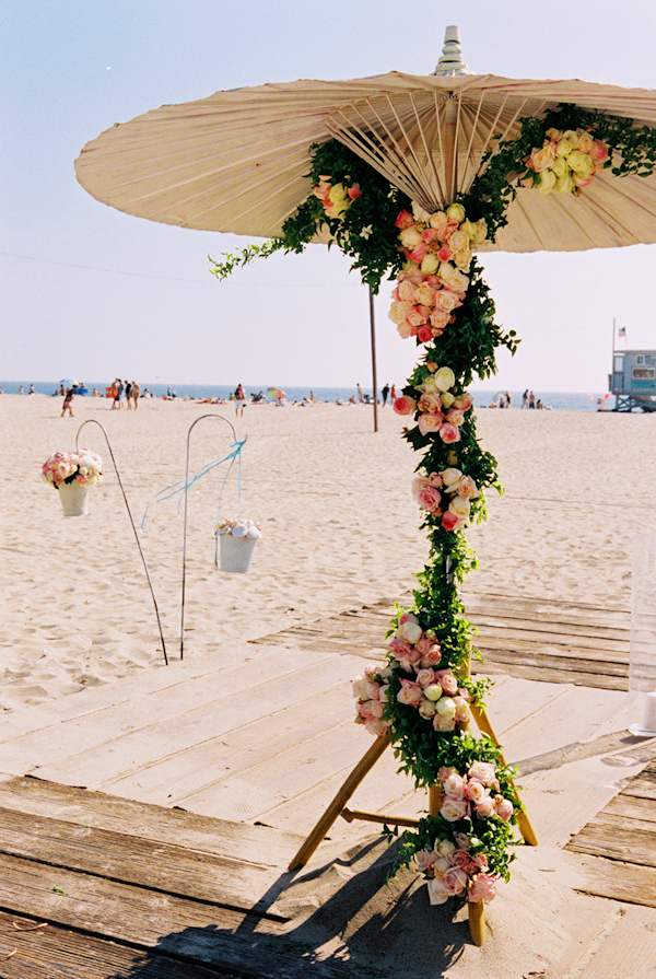 pink, white and yellow wedding altar floral decor  photo by Yvette Roman Photography